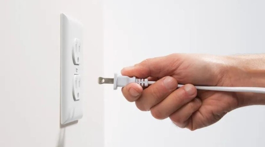 cord plugging into wall outlet