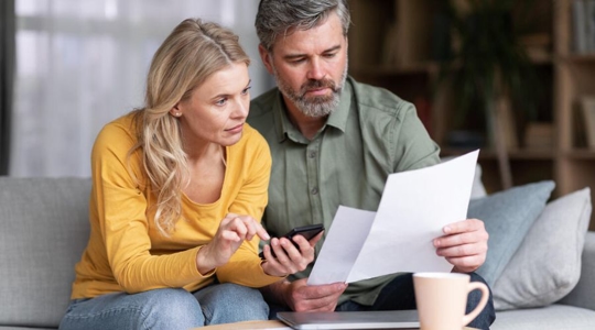 couple looking at bills